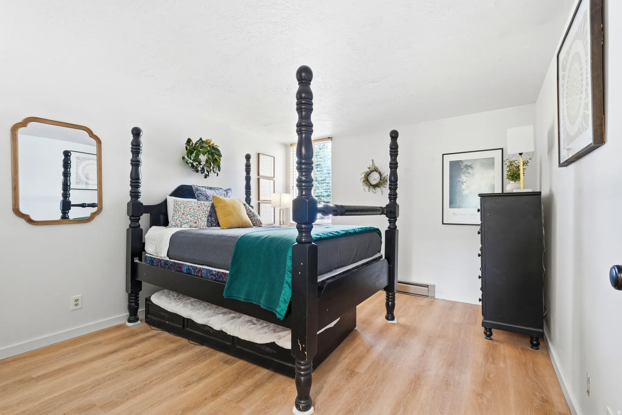 Bedroom featuring light wood-finish flooring and white walls