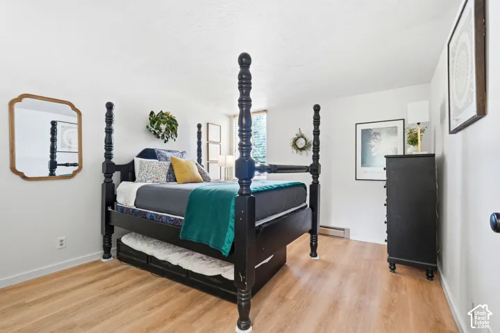 Bedroom featuring light wood-finish flooring and white walls