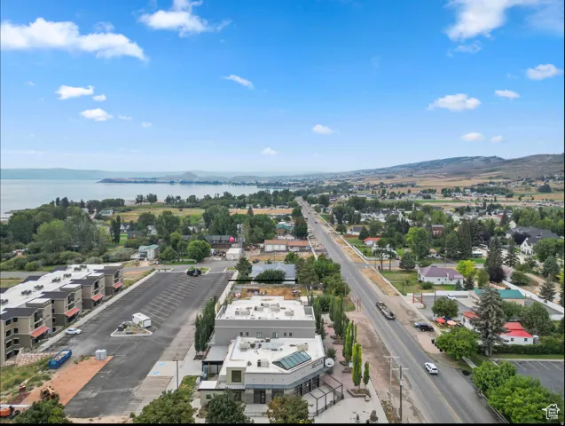 Townscape featuring a prominent lake and distant mountains