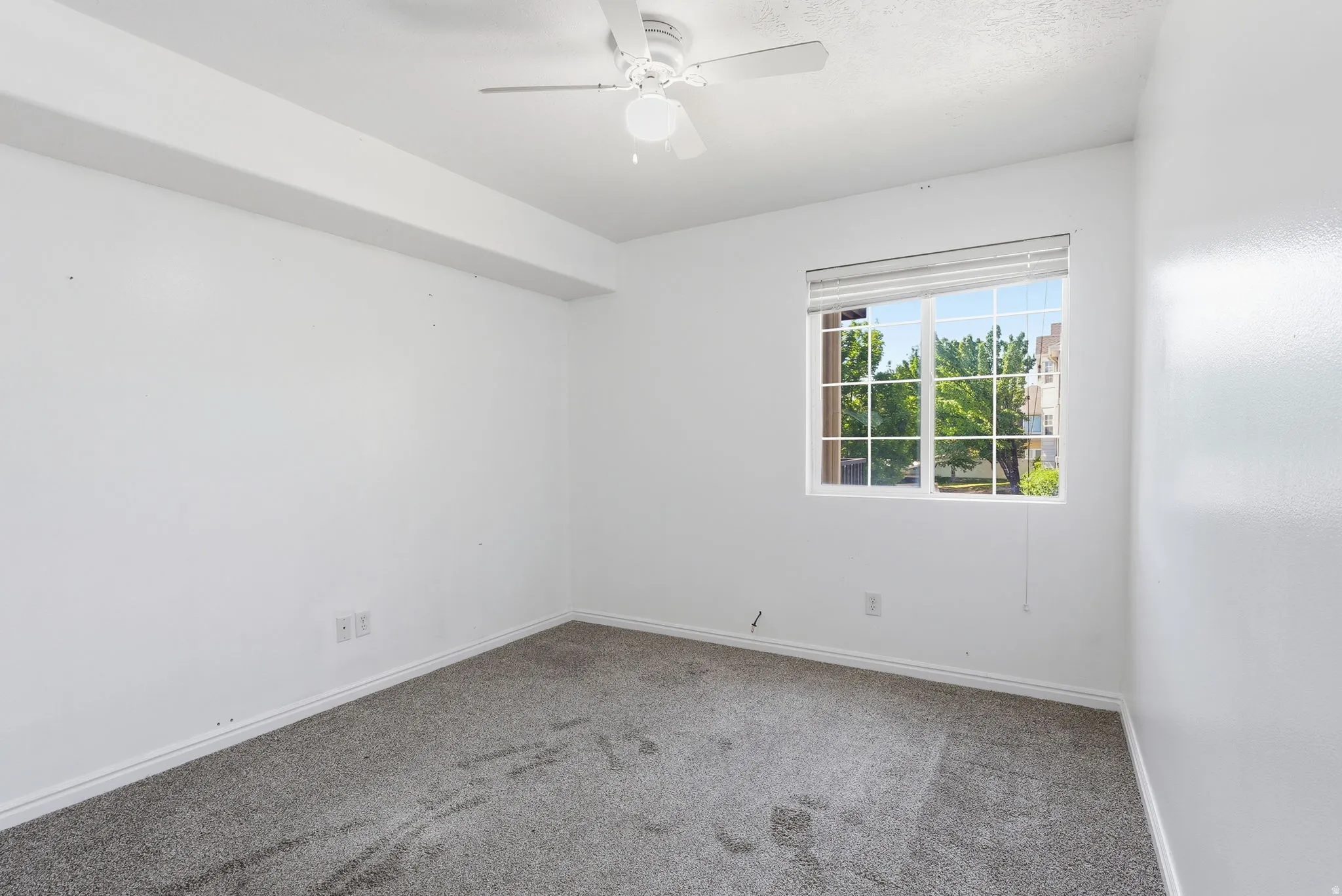 Bedroom 1 with blinds, and ceiling fan with