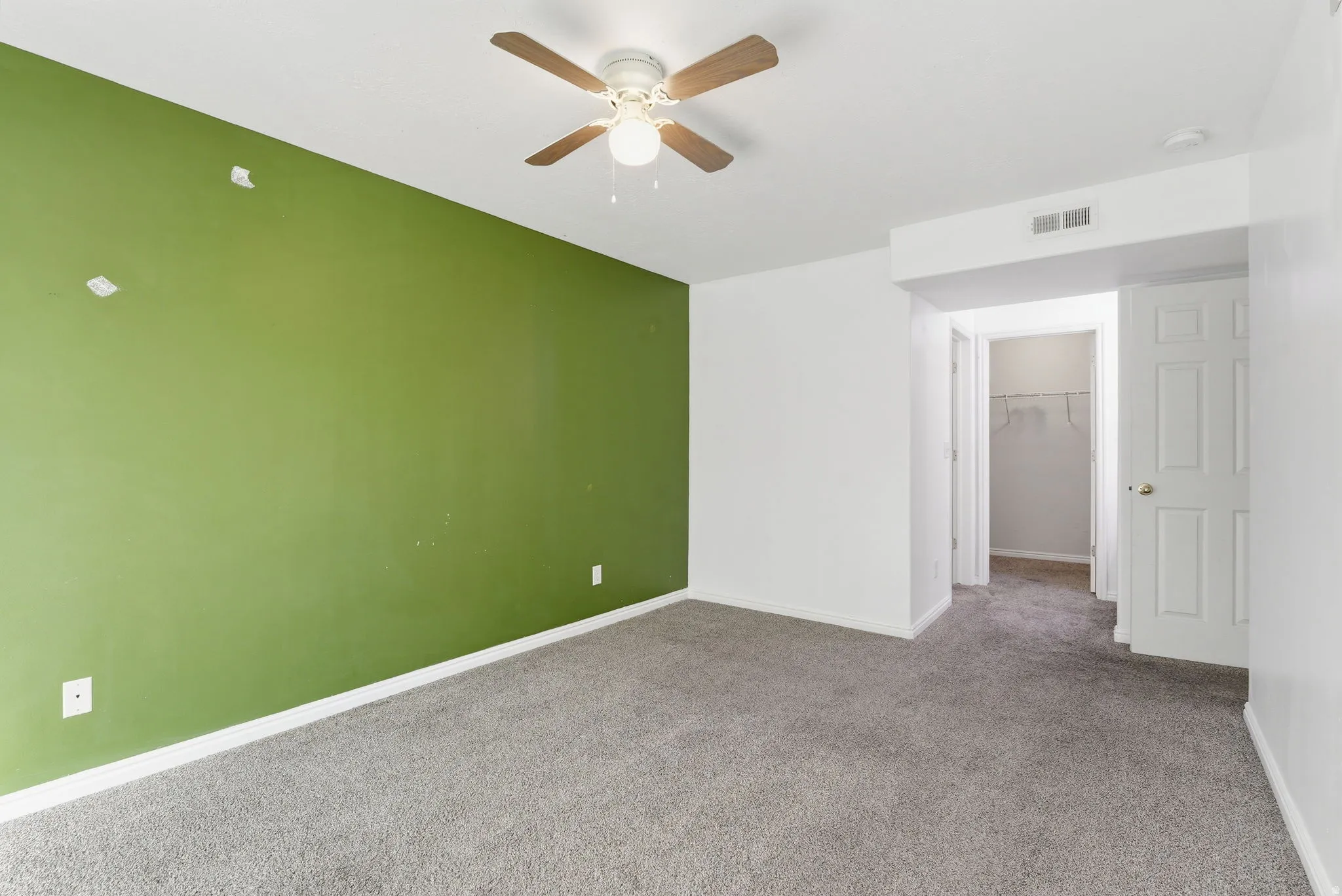 Master Suite featuring a ceiling fan