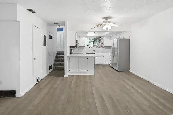Bright interior featuring wood-finish flooring throughout