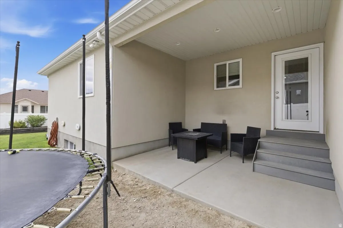 Covered patio with concrete flooring, recessed lighting, and direct outdoor access