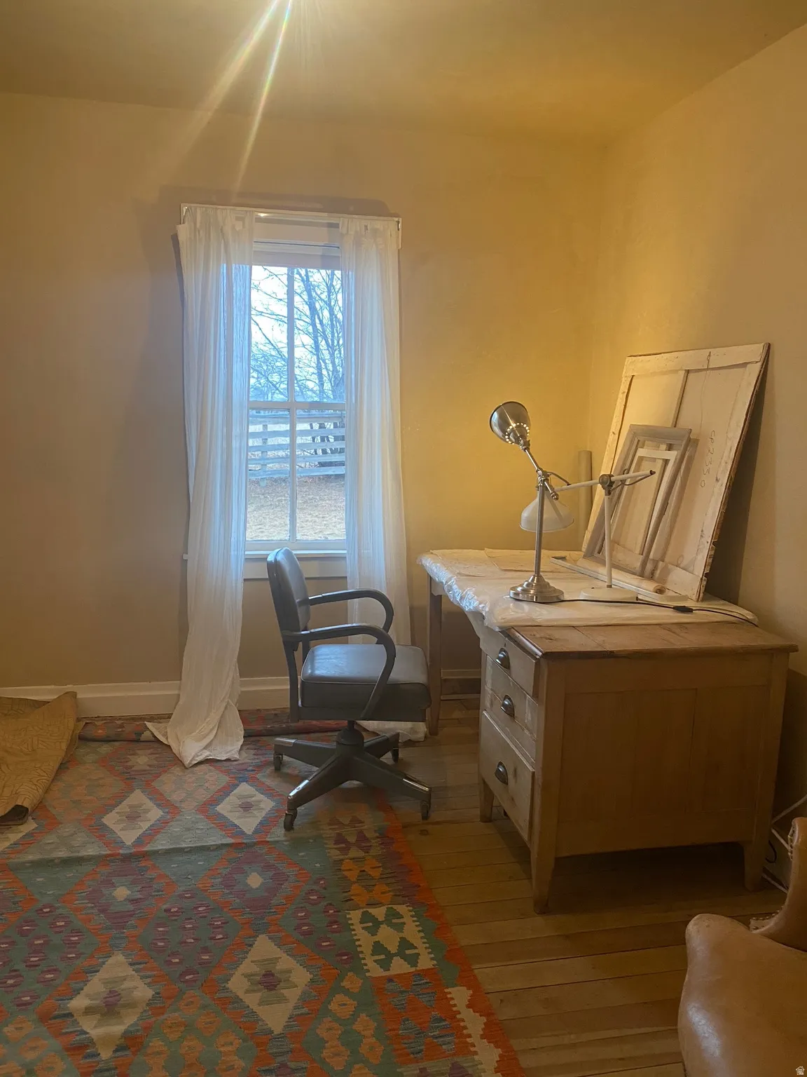 Room featuring wood flooring. May be used as a flex room