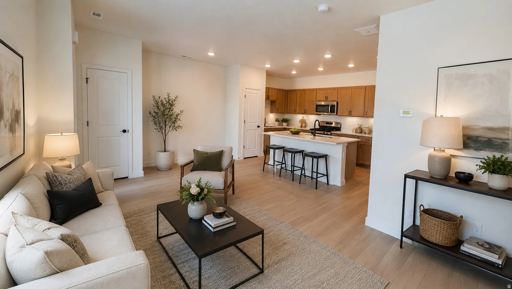 Open-concept living space featuring wood-finish flooring