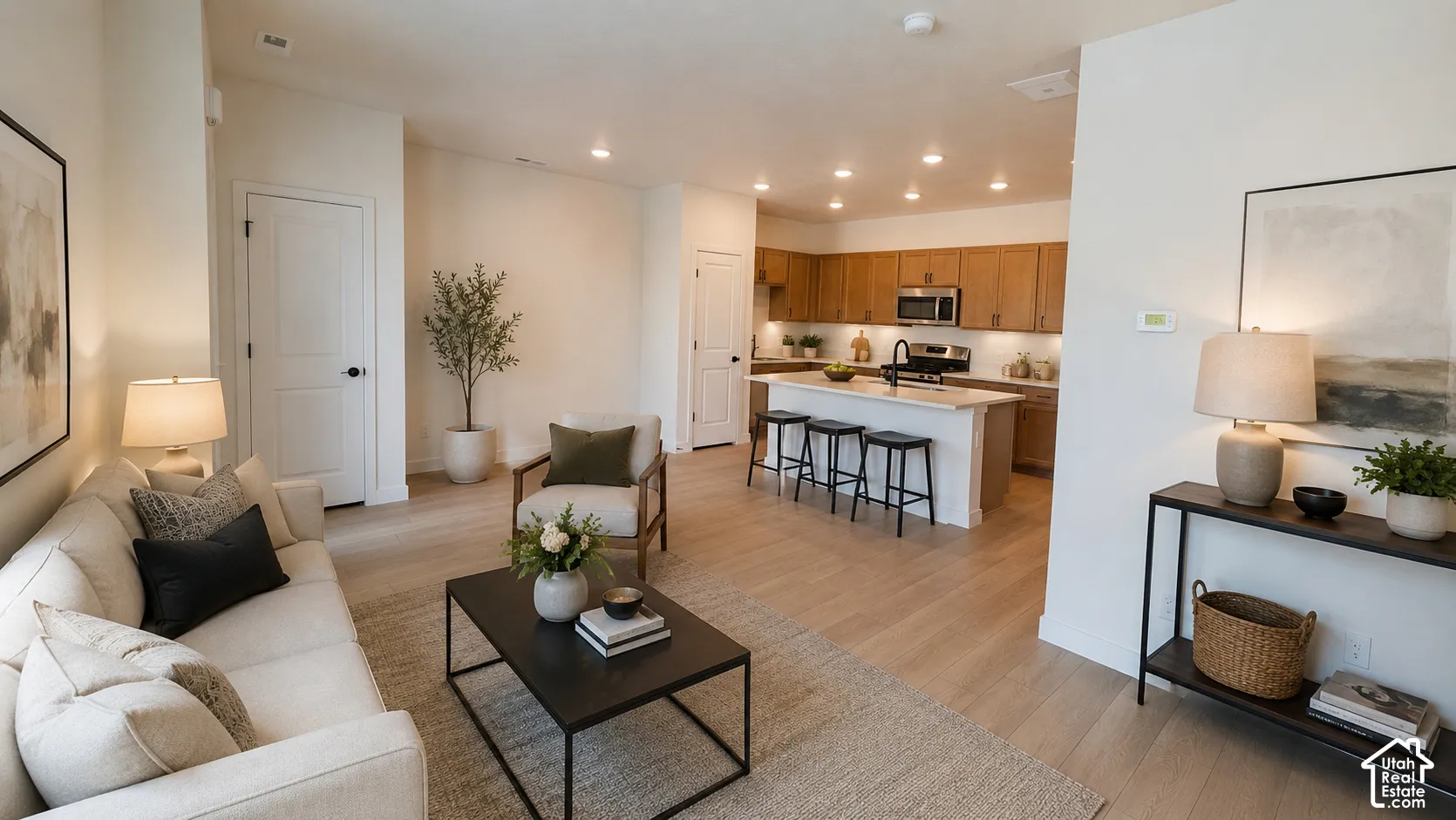 Open-concept living space featuring wood-finish flooring