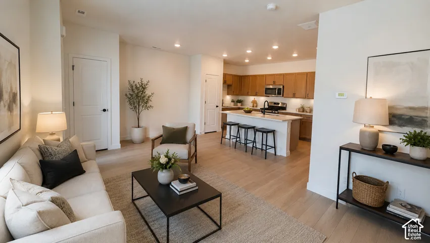 Open-concept living space featuring wood-finish flooring
