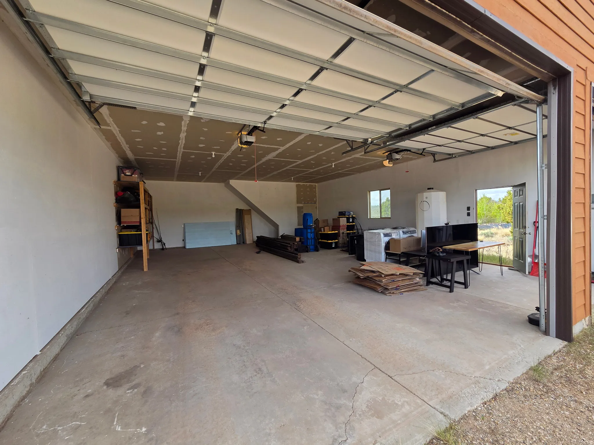 Two-story detached 6 car garage with spacious upstairs!