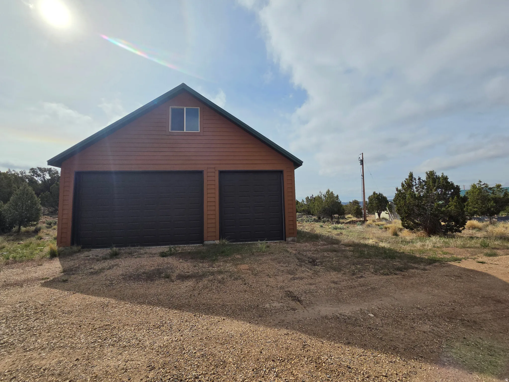 Two-story detached 6 car garage with spacious upstairs!