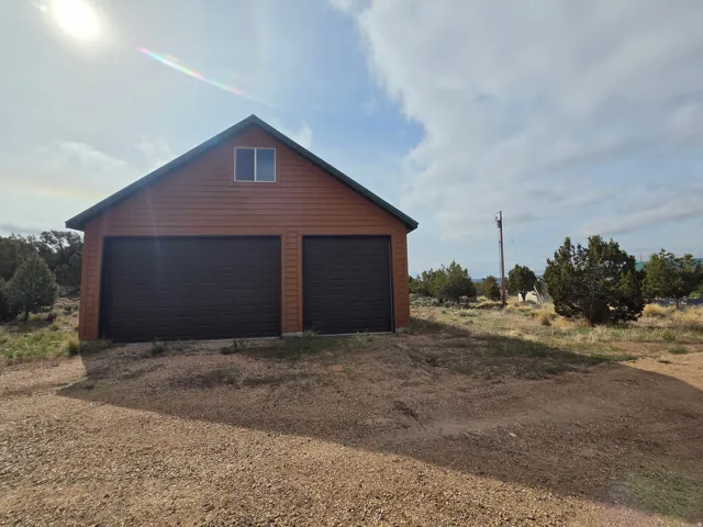 Two-story detached 6 car garage with spacious upstairs!