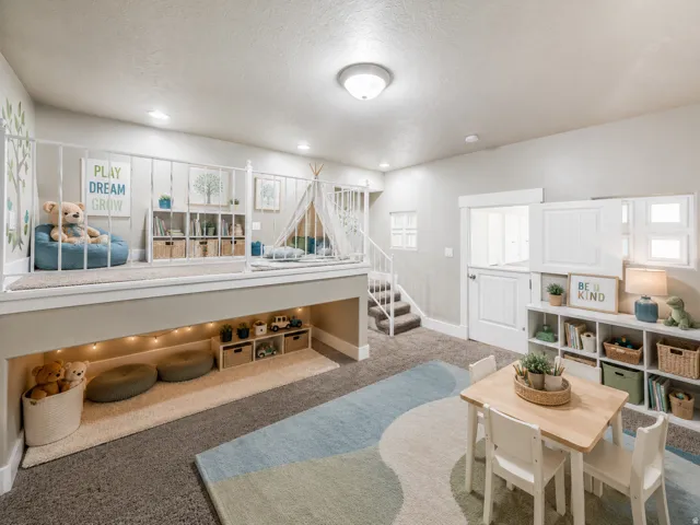 Multi-level interior space featuring a built-in play loft with a white spindle railing