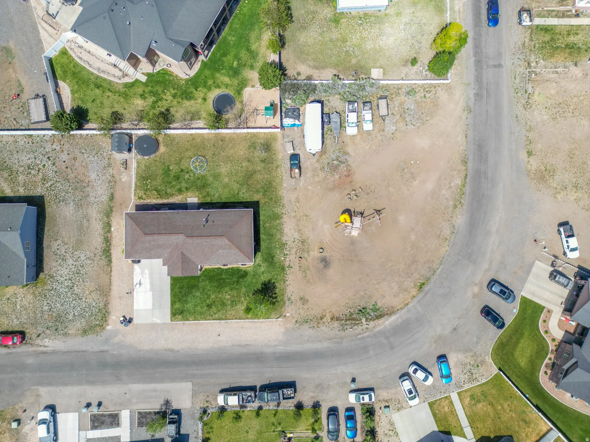 Single-story home with a brown shingle roof, a concrete driveway, and a partially grassed yard