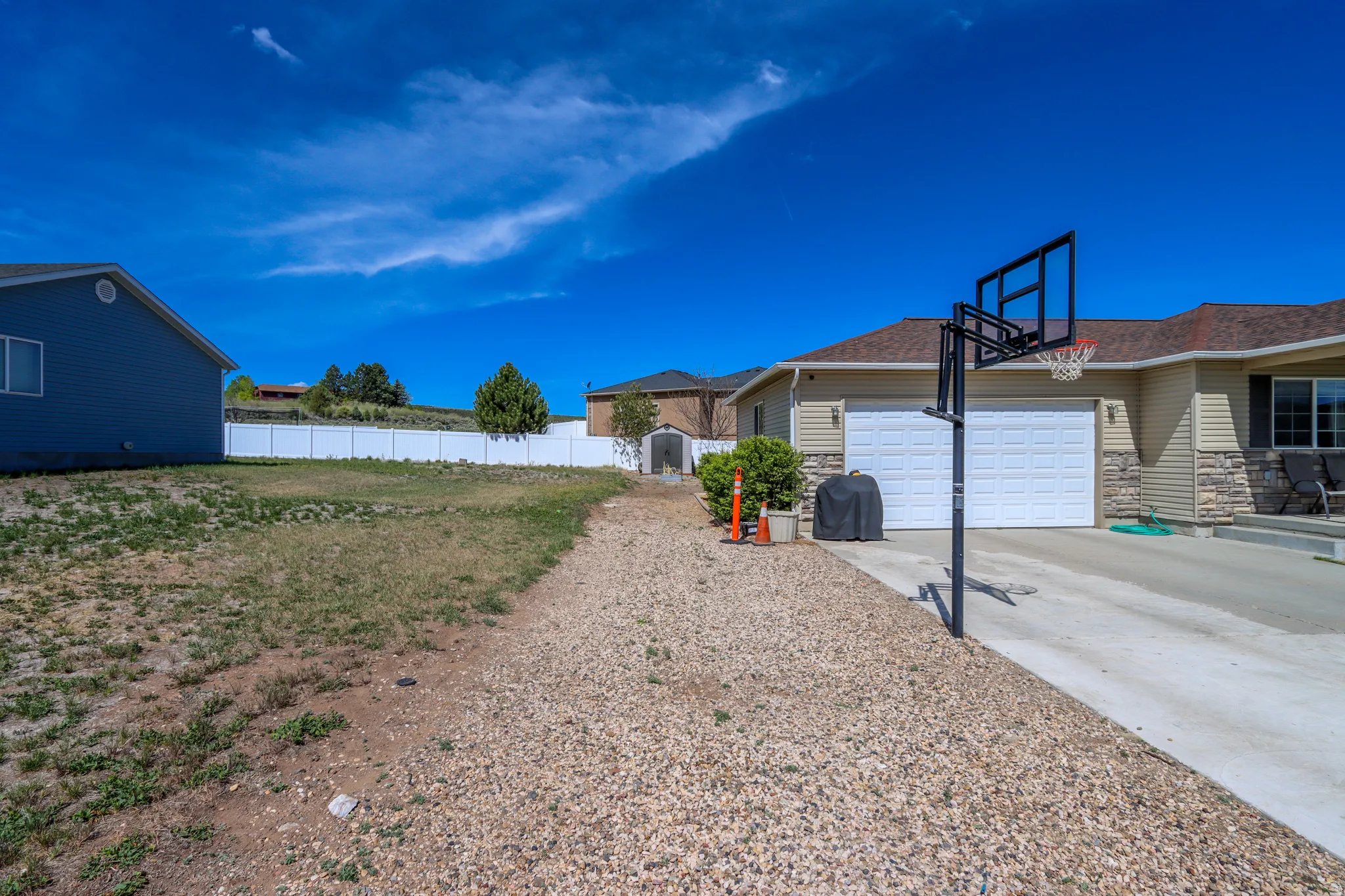 Ranch-style exterior with stone veneer and horizontal siding