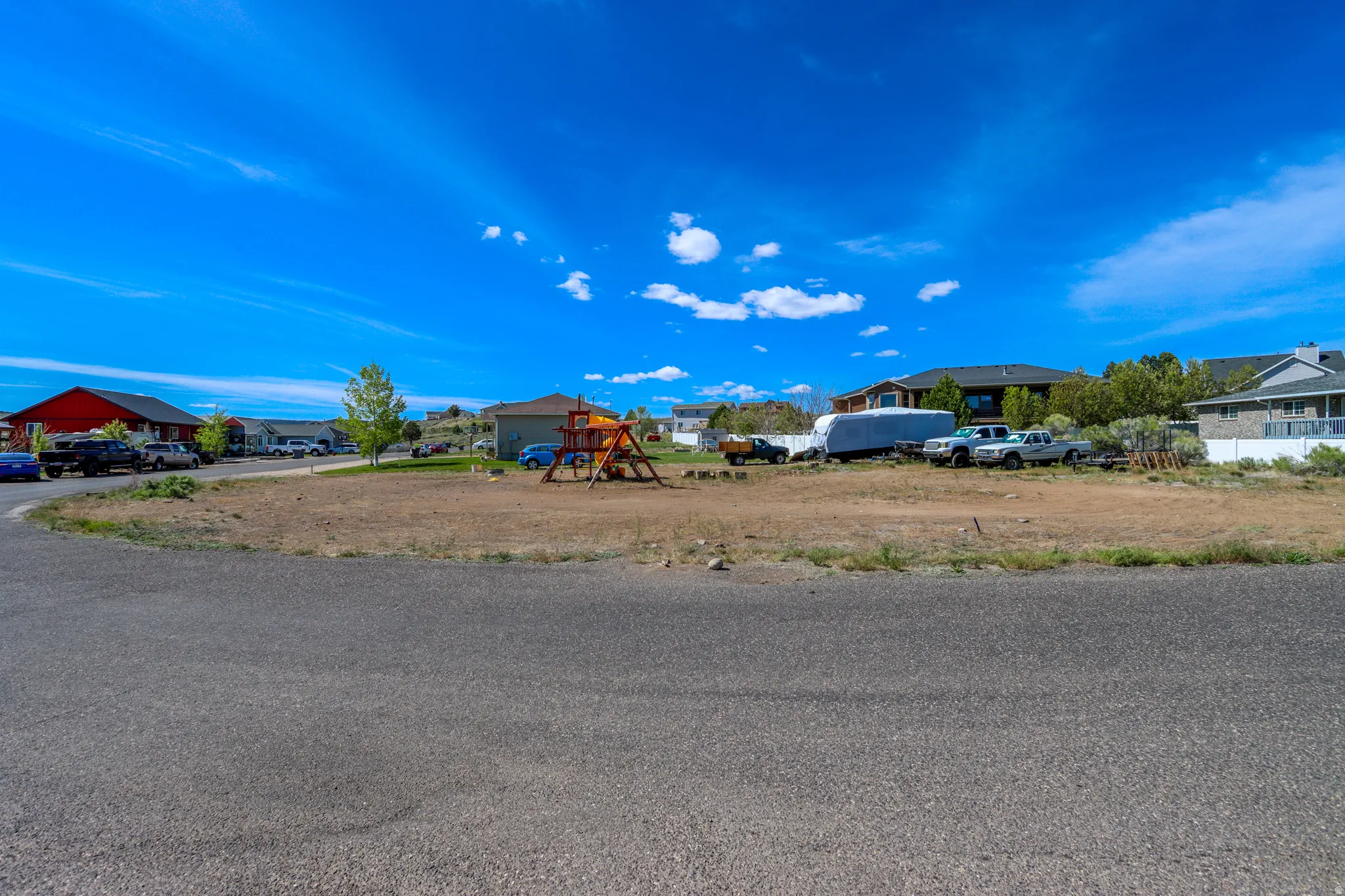 Expansive vacant lot with a clear building envelope, surrounded by established residential properties