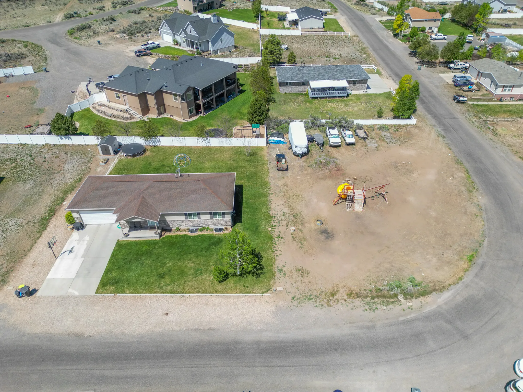 Ranch-style residence featuring a prominent front lawn and an attached garage