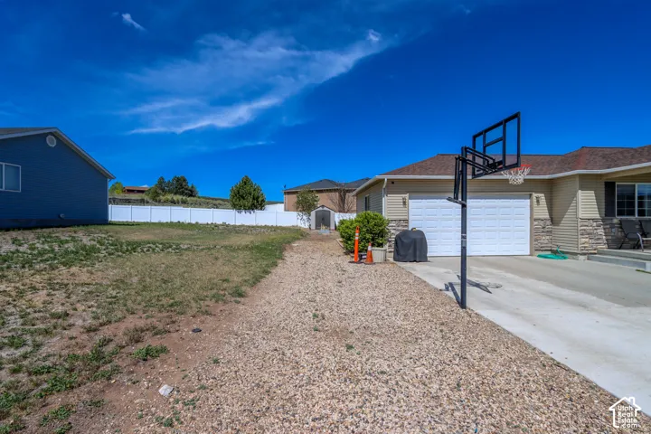 Ranch-style exterior with stone veneer and horizontal siding