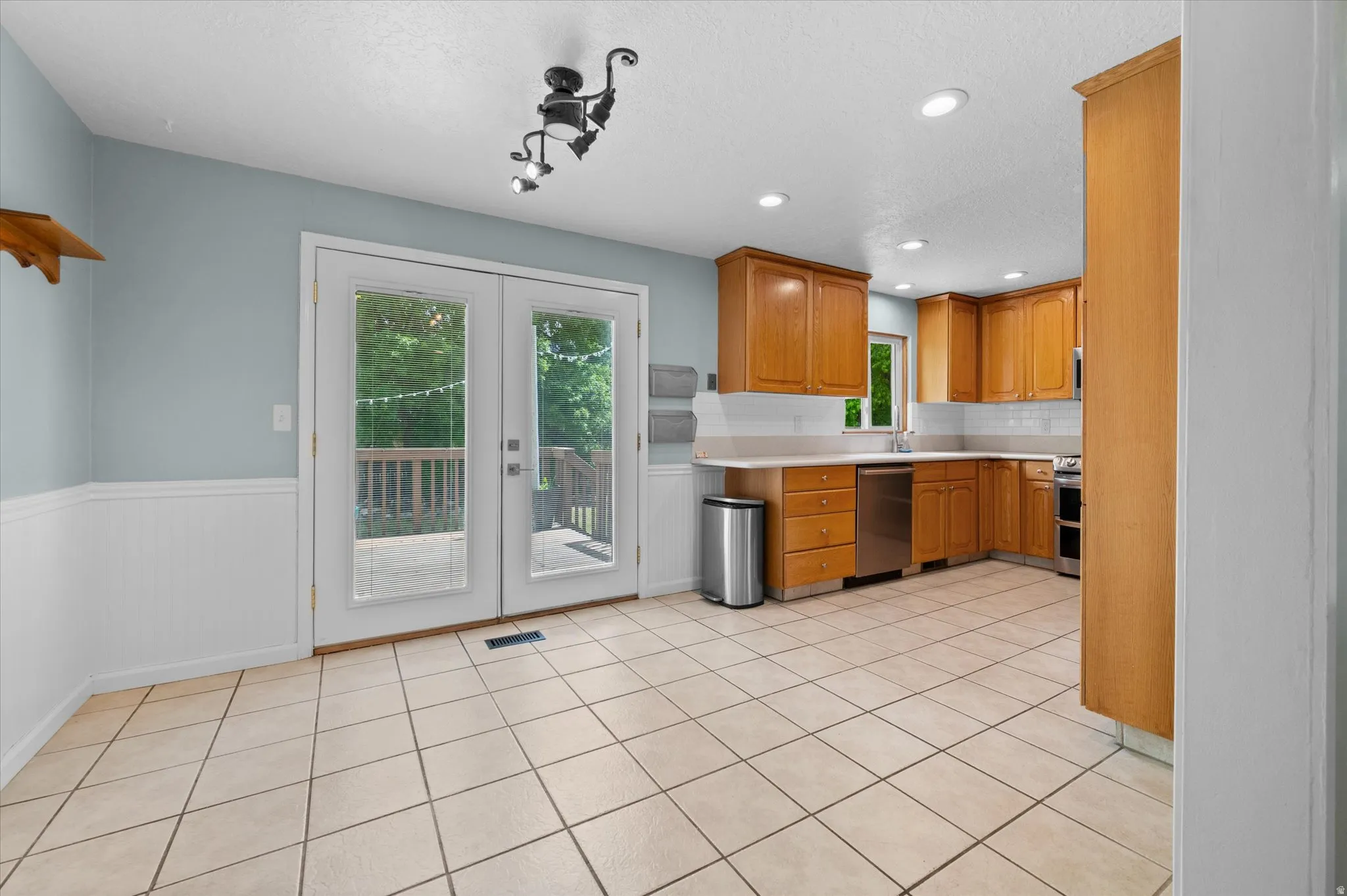 Kitchen featuring semi formal dining area, walkout to back porch, and natural lighting