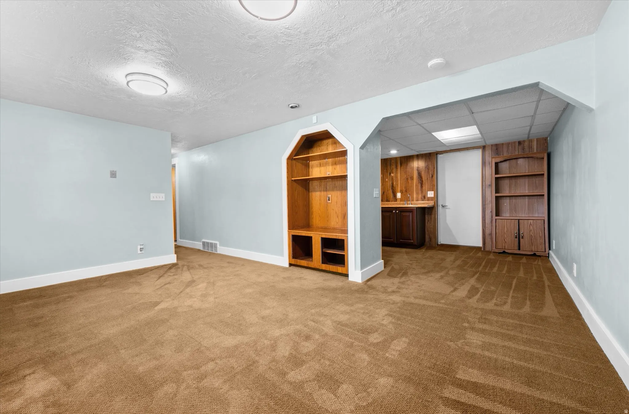 Spacious family room with with walkout to back yard, wet bar, and bonus room to be for exercise, office, etc.
