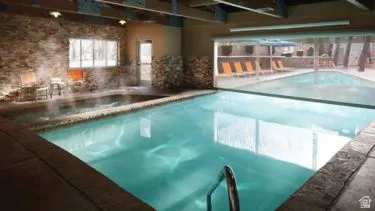 Indoor swimming pool with integrated hot tub