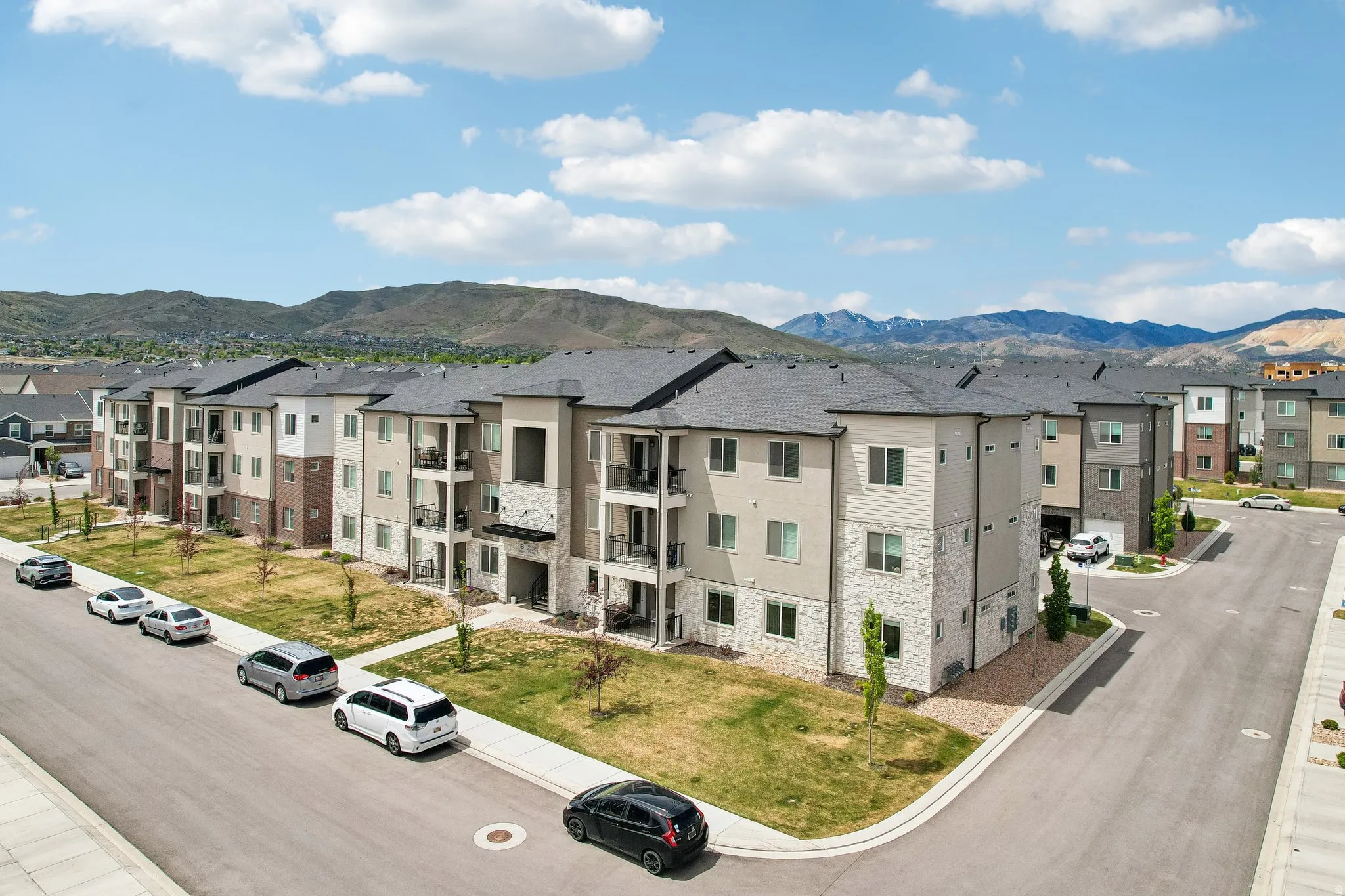 Multi-story residential buildings featuring contemporary architecture with stone and siding facades