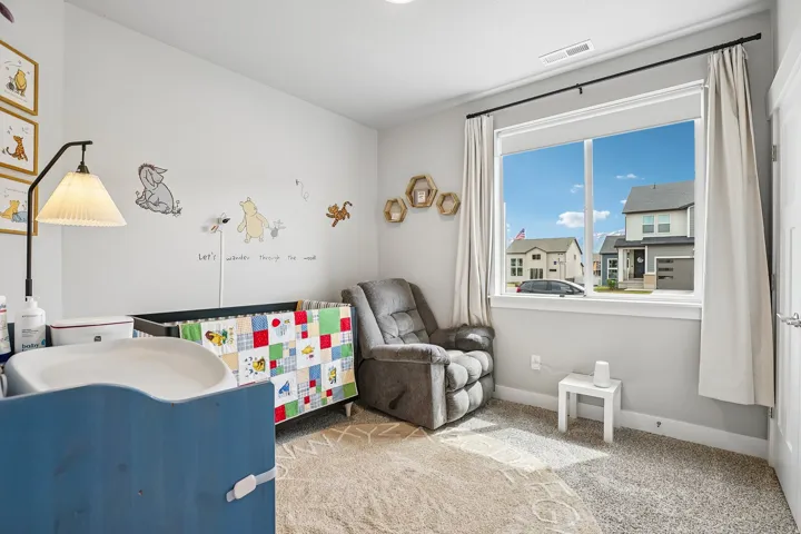 Light gray wall paint, white trim, and a large window with white framing