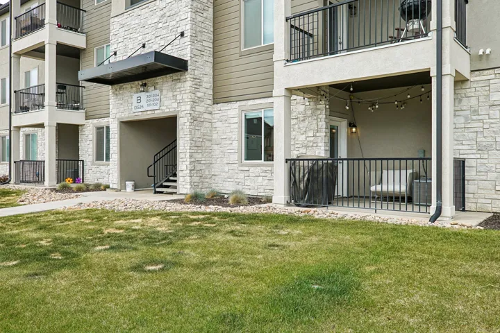 Stone veneer and siding exterior with a covered entry