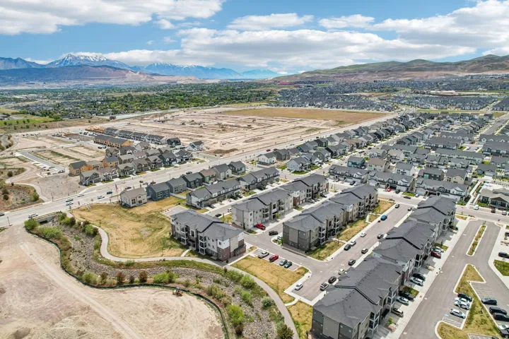 Aerial perspective showcasing a developing community with residential structures and infrastructure