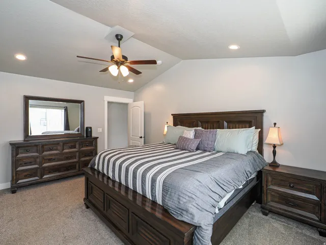 Bedroom featuring a vaulted ceiling, recessed lighting, and a ceiling fan