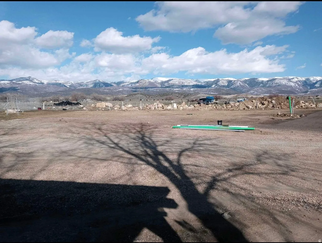 Expansive lot featuring a clear, open terrain and distant snow-capped mountains