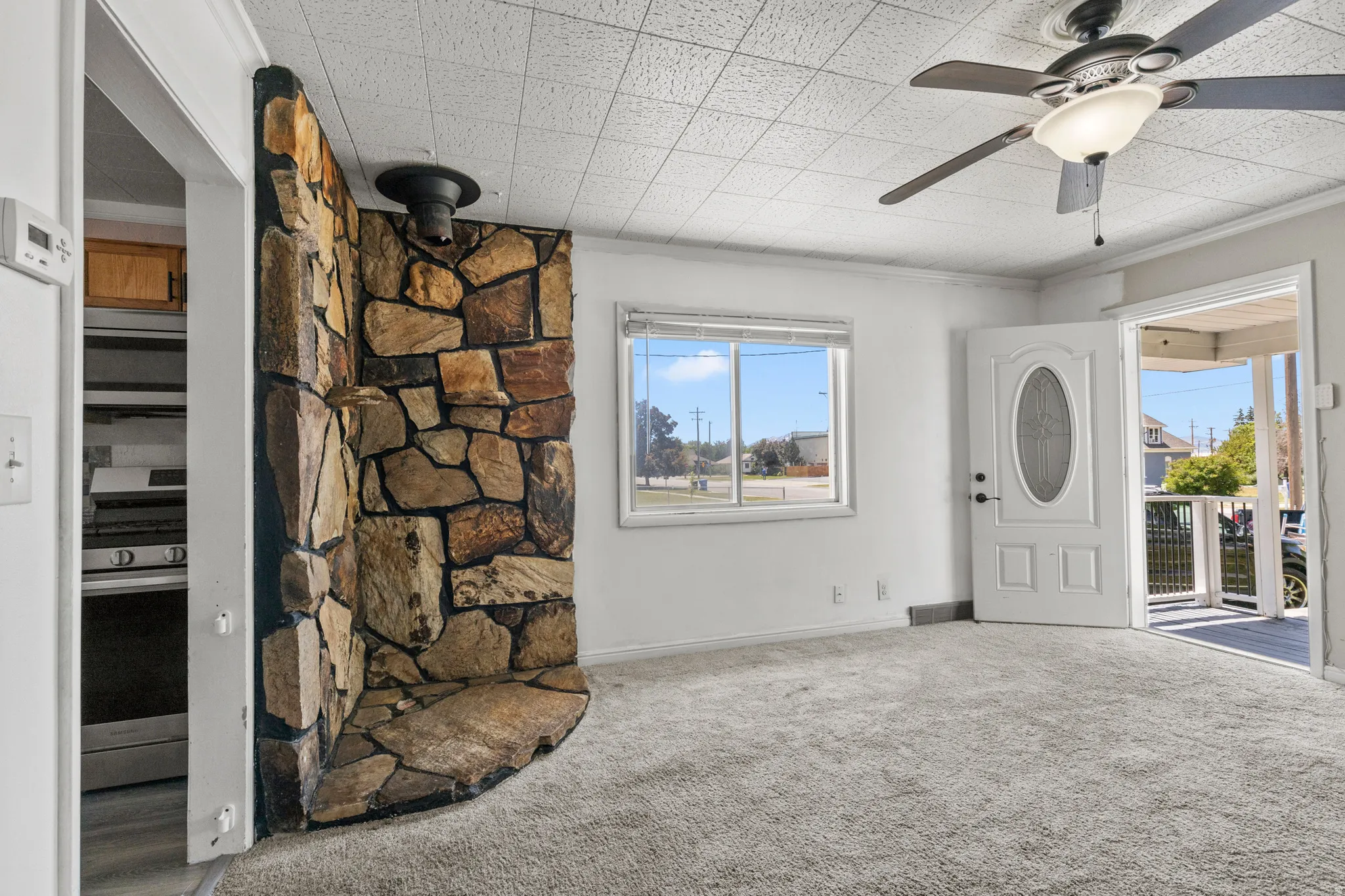 Natural stone accent wall with a curved hearth