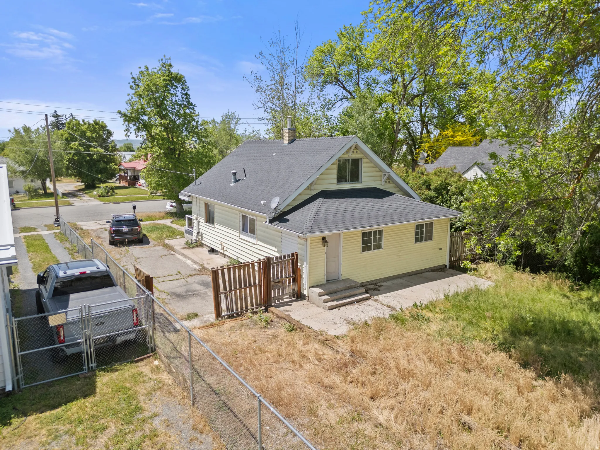 Vinyl siding; new roof.  Swing gate for vehicles to drive through.  Patio off back of house. Concrete on each side of the home for easy maintenance.