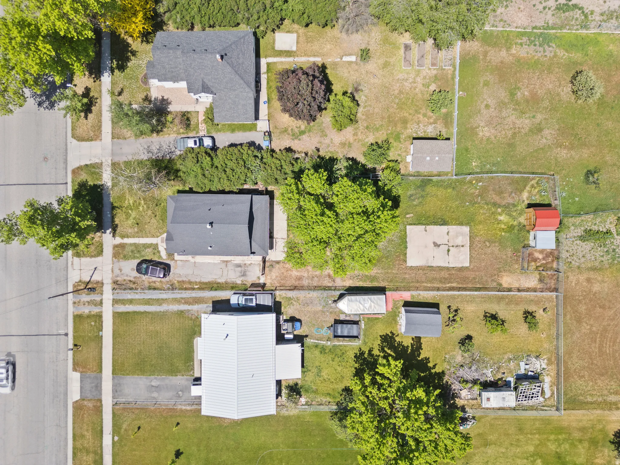 Aerial view of established neighborhood and wow, what a lot.  Think of all the things you can do with an outbuilding, storage for trailers, campers, or animals, ????