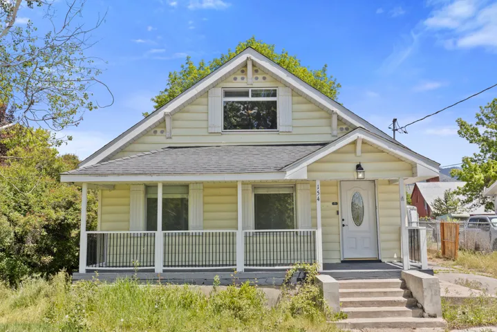 Traditional-2-story with lovely covered porch on trek decking. Home faces west on 300 west.