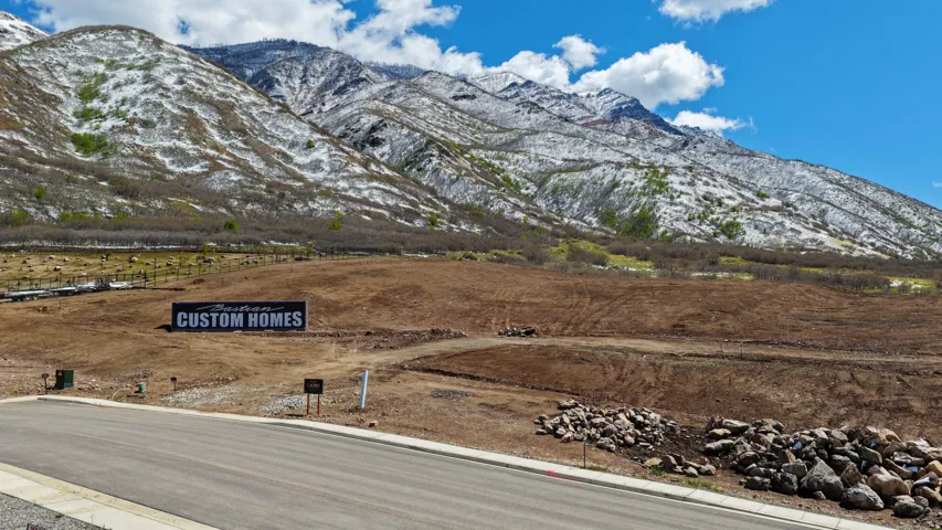 Development land with mountain backdrop and clear skies