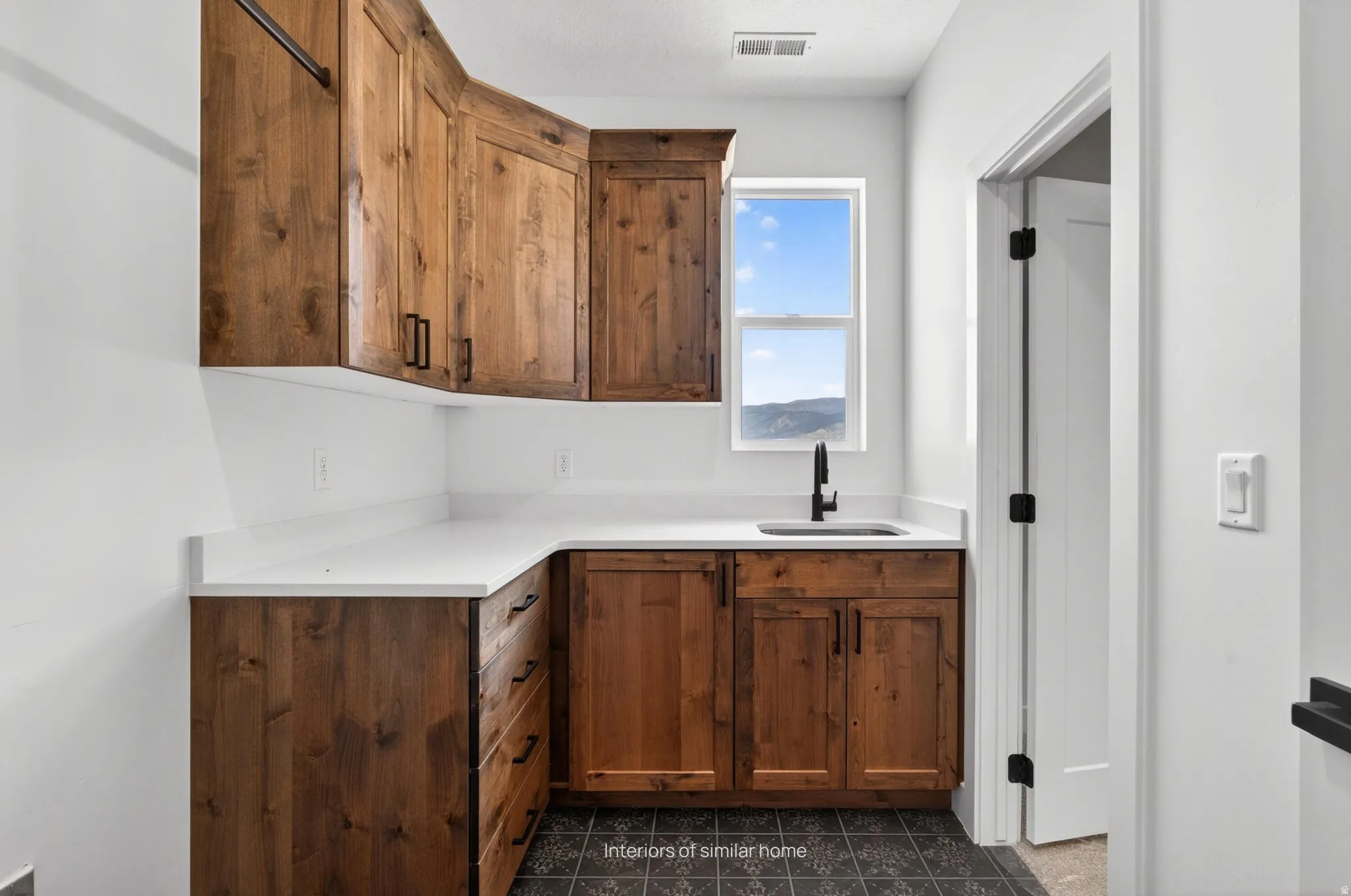 Interiors are from a similar home