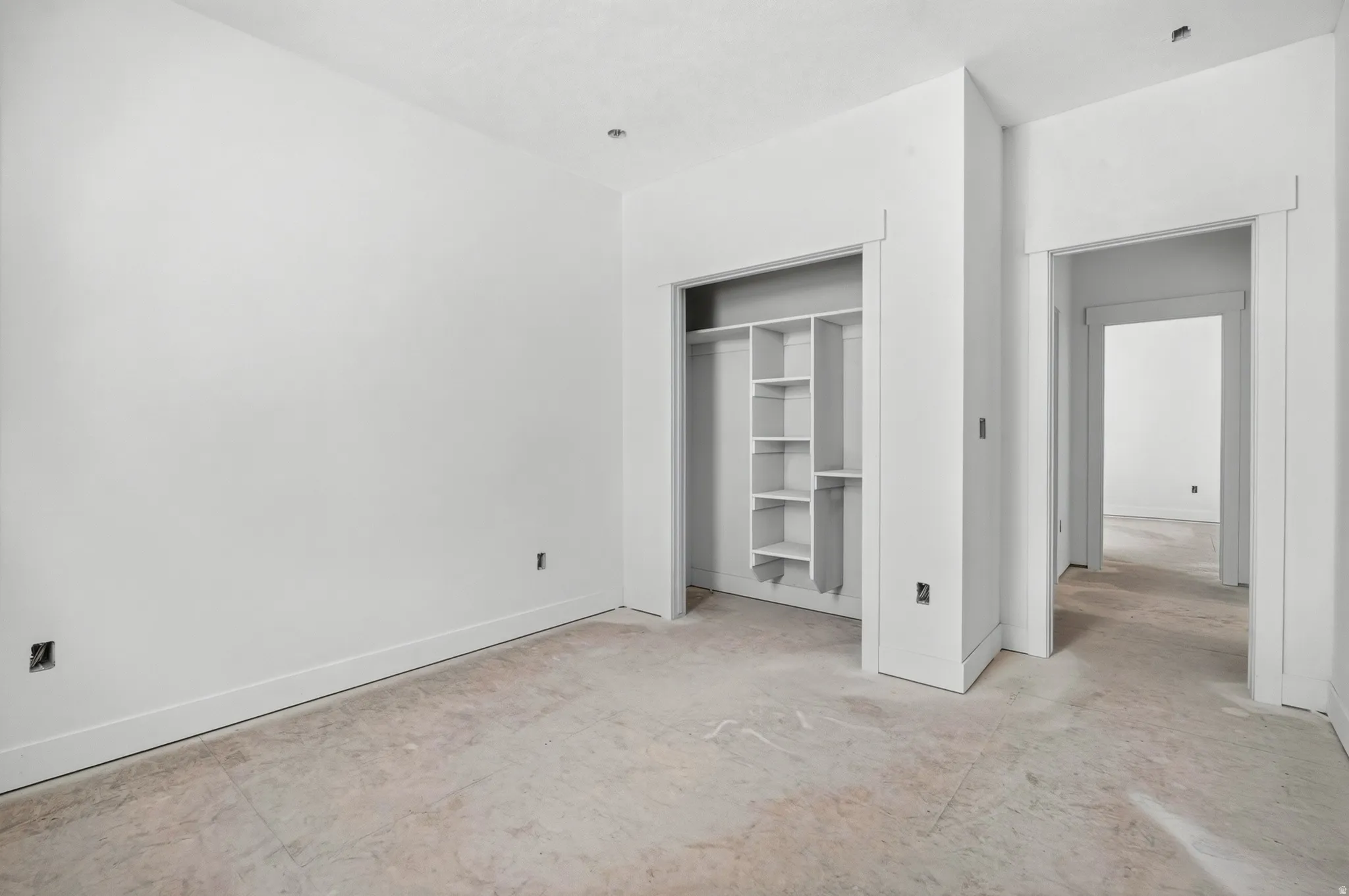 Recessed lighting, built-in closet shelving, and multiple doorway entries