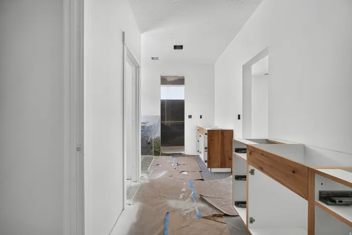 Wood-finish cabinetry framing an open doorway