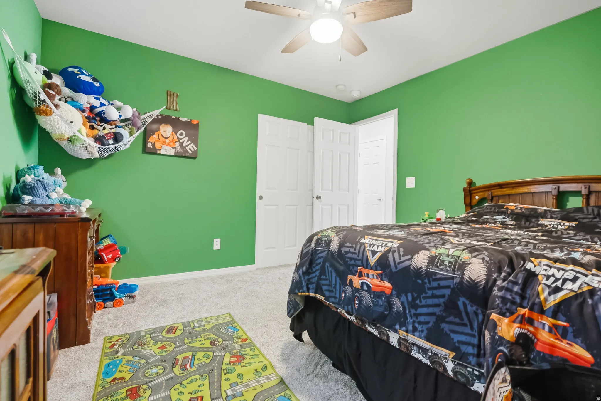 Interior room featuring vibrant green walls and light-toned carpeting