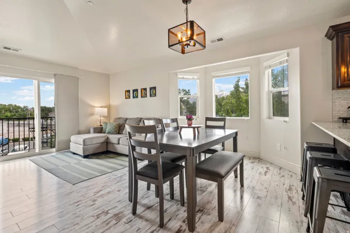 Open-concept living area with light wood-finish flooring