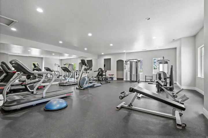 Dedicated fitness space featuring rubberized flooring