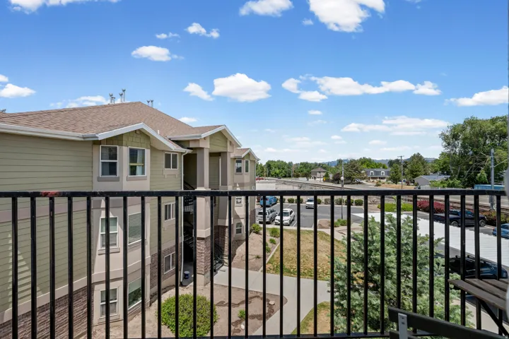 Balcony offering outdoor space with black metal railings