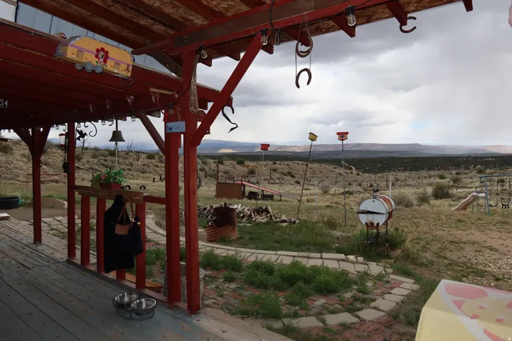 View of yard featuring a rural view and a deck with mountain view