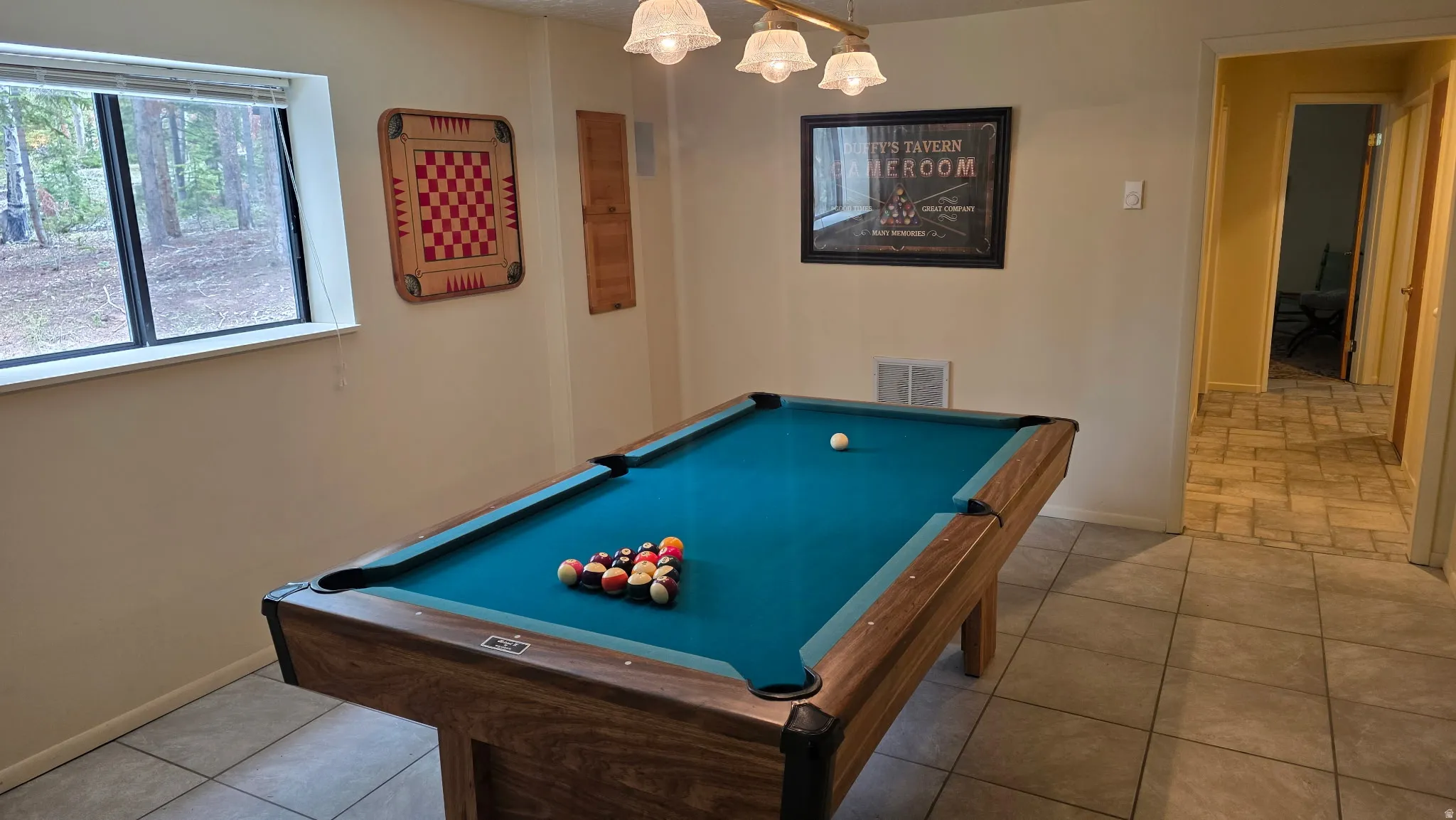 Recreation area on ground level looking to hallway to four bedrooms and a bath