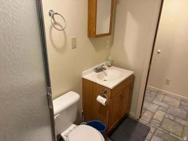 Vanity and tile flooring in bath down