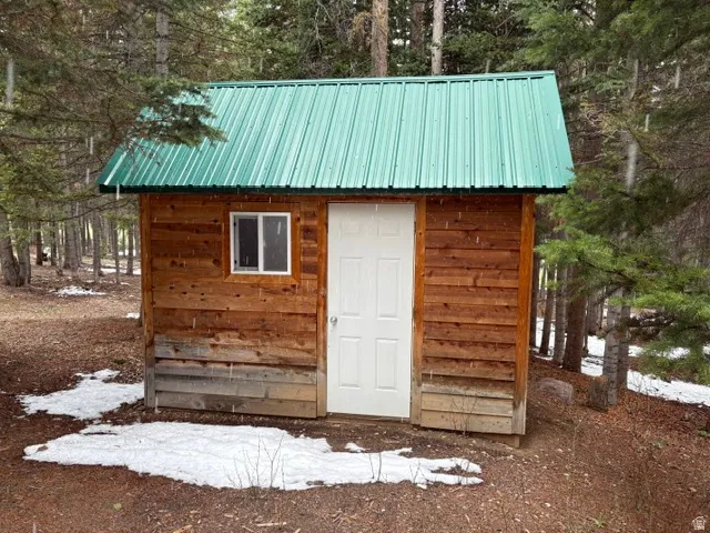 Shed with built-in shelves for storing tools and other items