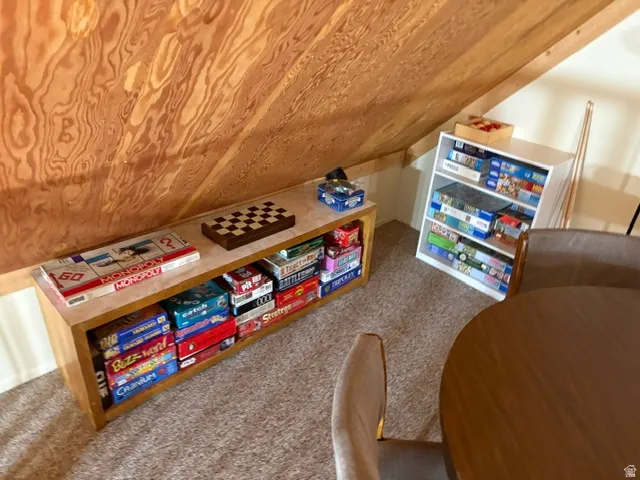 Storage shelving and a bookcase for games, books and puzzles
