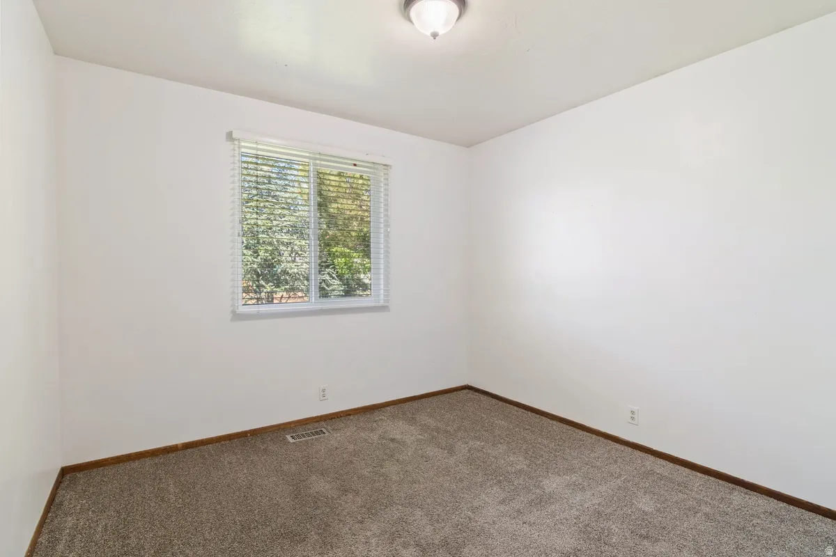 Neutral-toned carpeting paired with white walls