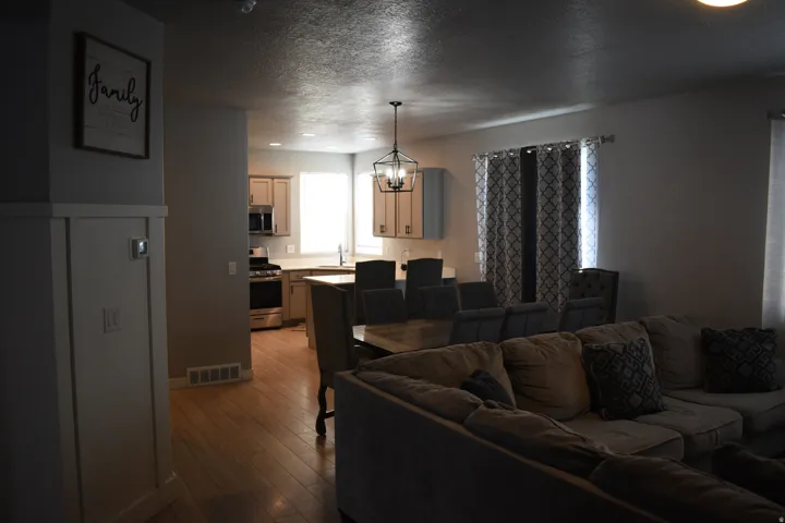 Open-concept living space featuring wood-finish flooring