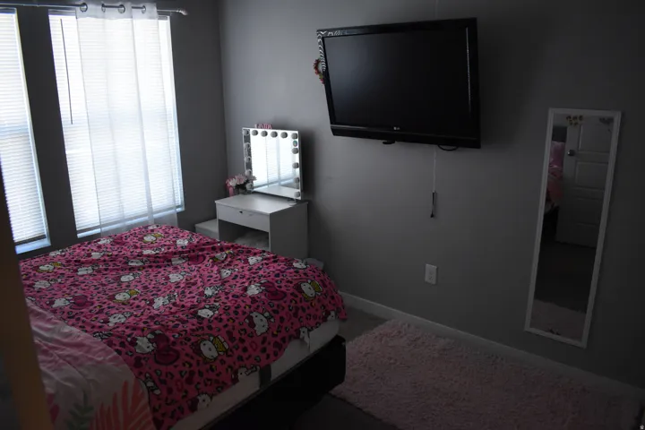Room with dual windows featuring blinds