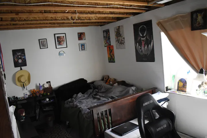 Interior room featuring exposed ceiling joists and white walls